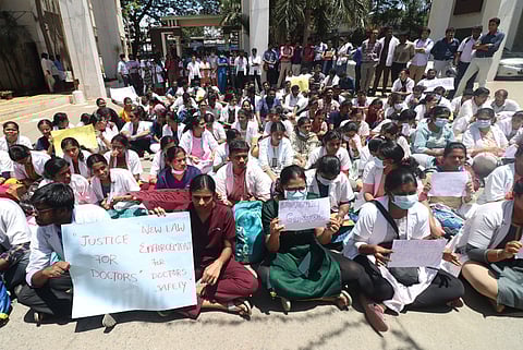 The house surgeons staged a sit-in protest in front of the deans office on the hospital premises on Thursday