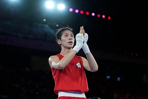 Taiwan's Lin Yu-ting celebrates after defeating Poland's Julia Szeremeta in their women's 57 kg final boxing match at the 2024 Summer Olympics.