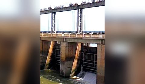 Water leaks from a closed crest gate of the Singatalur dam.