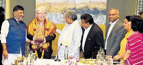 DyCM DK Shivakumar, Chief Minister Siddaramaiah, Industries Minister MB Patil and IT, BT Minister Priyank Kharge felicitate Foxconn CEO and chairman Young Liu in Bengaluru on Friday