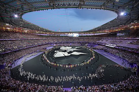 Flag bearers march during the 2024 Summer Olympics closing ceremony at the Stade de France, Sunday, Aug. 11, 2024, in Saint-Denis, France.
