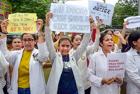 CBI officials outside the residence of former principal of RG Kar Medical College Sandip Ghosh, in Kolkata, Sunday, Aug. 25, 2024. 