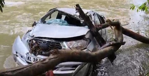Mullaringadu church vicar's car being swept away in the flood water on Friday night
