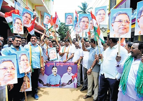 Congress workers stage a protest against Governor Thaawarchand Gehlot, BJP and JDS, in the wake of the decision sanctioning prosecution of Chief Minister Siddaramaiah in the MUDA case, in BS Yediyurappa’s stronghold of Shikaripura on Sunday.