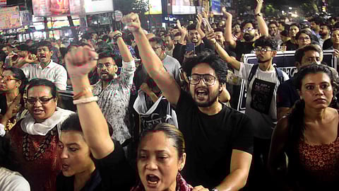 Artists and others during a protest rally against the recent alleged rape and murder of a woman doctor at RG Kar Medical College and Hospital, in Kolkata
