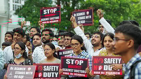 Members of Resident Doctors Association of the Deen Dayal Upadhyay Hospital protest against the alleged rape and murder of a trainee doctor at Kolkata's RG Kar Medical College and Hospital, at Connaught Place, in New Delhi, Sunday, Aug. 18, 2024. 