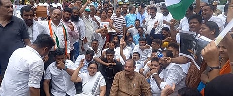 Congress MLC Ivan D'souza during a road protest against the MUDA scam allegations on CM Siddaramaiah.