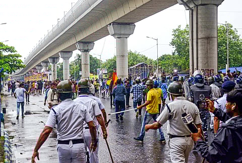 Rapid Action Force (RAF) personnel disperse Mohun Bagan and East Bengal supporters protesting against the alleged rape and murder of RG Kar Hospital doctor, at Salt Lake Stadium in Kolkata on Sunday.