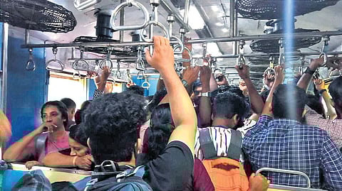 Passengers inside a crowded MEMU train 