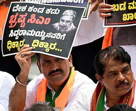 BJP State President B Y Vijayendra and LOP leader R Ashoka with party MPs, MLAs and MLCs protest against Chief Minister Siddaramaiah