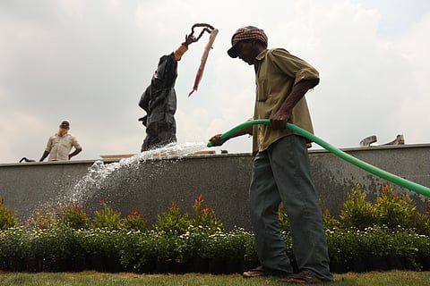 With the statue of Rajiv Gandhi set to be unveiled soon, workers are seen busily completing the final tasks in the garden near the Secretariat in Hyderabad. 