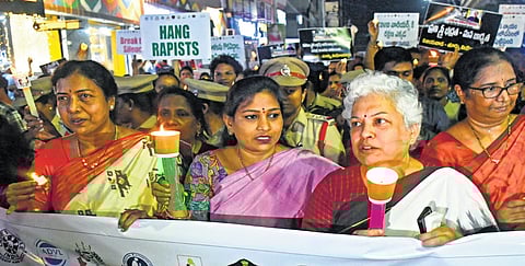 Home Minister V Anitha takes part in a candlelight march held in  Vijayawada to condemn the rape and murder of a trainee doctor in Kolkata