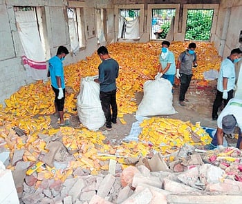 The staff of Saniclean packing the expired sanitary pads for disposal