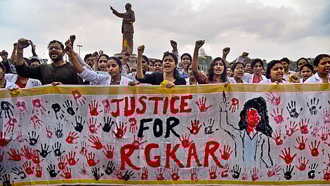 Doctors stage a protest demanding justice for a woman doctor who was allegedly raped and murdered at Kolkata's R G Kar Medical College and Hospital.