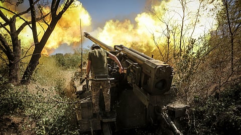 Servicemen of the Ukirane army's 24th Mechanised Brigade fire a "Giatsint-S" 152mm self-propelled howitzer towards Russian positions near Chasiv Yar town, in the Donetsk region of Ukraine, on Tuesday, Aug. 20, 2024.