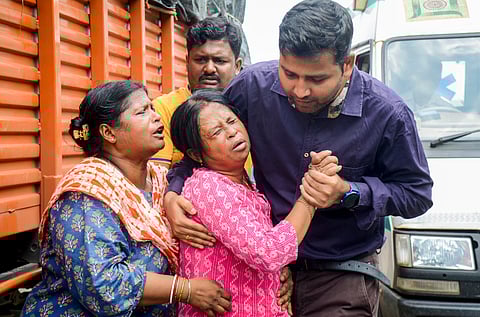 Relatives of Subhrodeep Dutta, trainee pilot of missing aircraft, lose their control after his body was recovered by rescue teams during the search operation, at a hospital in Seraikela-Kharswan district, Thursday, Aug. 22, 2024. 