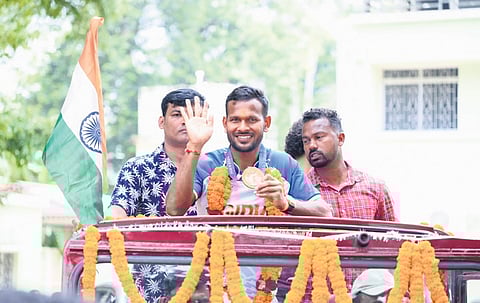 Amit Rohidas waving to the crowd in Sundargarh town
