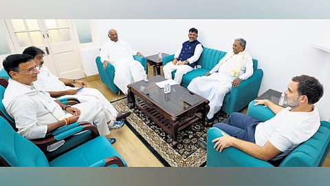 AICC chief Mallikarjun Kharge, LoP in Lok Sabha Rahul Gandhi in conversation with CM Siddaramaiah and DyCM DK Shivakumar in New Delhi on Friday. AICC general secretaries KC Venugopal and Randeep Singh Surjewala look on