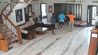 CCTV footage shows two armed assailants pointing a gun at the victim.