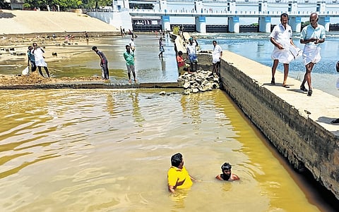 Srirangam MLA M Palaniyandi inspecting the canal at Mukkombu on Monday 