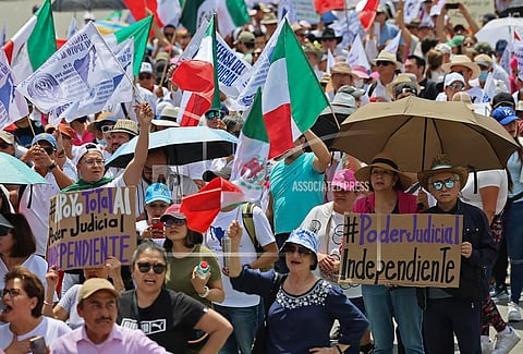 Federal court workers gather as they strike over reforms that would make all judges stand for election in Mexico City, Sunday,