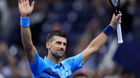 Novak Djokovic, of Serbia, reacts after defeating Radu Albot, of Moldova, during a first round match of the U.S. Open tennis championships.