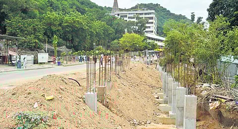 Elevated queue line works come to a halt at Durga temple.