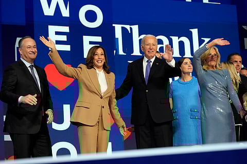 President Joe Biden and first lady Jill Biden stand on stage with Democratic presidential nominee Vice President Kamala Harris and second gentleman Doug Emhoff during the first day of Democratic National Convention.