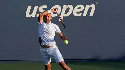 Daniel Evans of Great Britain returns against Karen Khachanov of Russia during their match at the US Open