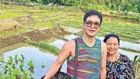 Jenjum Gadi with his mother in her garden