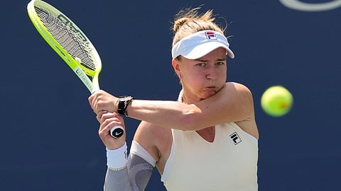 Barbora Krejcikova, of the Czech Republic, returns a shot to Elena-Gariela Ruse, of Romania, during the first round of the U.S. Open tennis championships, Wednesday, Aug. 28, 2024, in New York.
