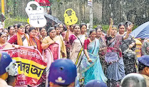 BJP Mahila Morcha workers stopped by the police during a protest march to the state women commission in Salt Lake on Friday