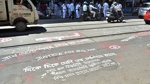 An art depicting 'Justice for RG Kar' painted on the road during the Junior doctors' protest against the RG Kar Medical College and Hospital rape-murder case, at Kolkata Medical College and Hospital in Kolkata on Thursday.