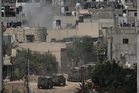 Israeli armoured vehicles move during a military operation in the West Bank Jenin refugee camp, Saturday.