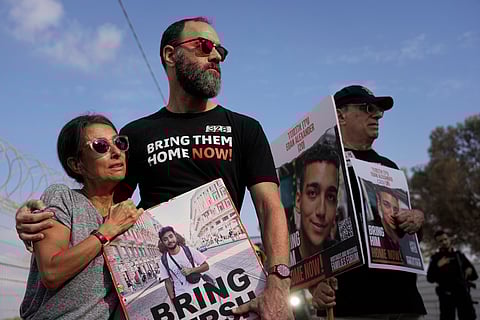 Thousands of protesters lift flags and placards during an anti-government rally calling for the release of Israelis held hostage by Palestinian militants in Gaza since October, in Tel Aviv on September 1, 2024.