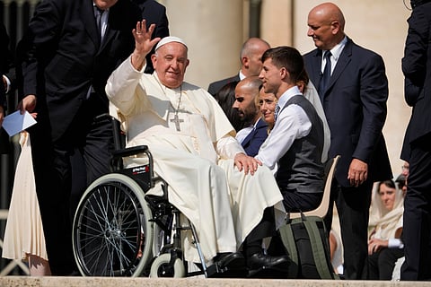 Pope Francis waves as he leaves after his weekly general audience in St. Peter's Square at The Vatican, Aug. 28, 2024.