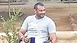 A screengrab of a video that went viral shows actor Darshan holding a mug and a cigarette in Bengaluru Central Prison