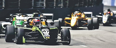 Race 2 riders during the Formula 4 night street race in Chennai on Sunday. Aqil Alibhai (Car No. 47) won the round 2 of race 2