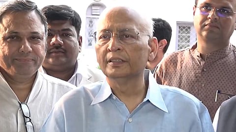 Congress leader Abhishek Manu Singhvi speaks to the media after a meeting at the AICC headquarters in Delhi, on Sunday.