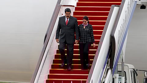 Venezuela's President Nicolas Maduro, left, and first lady Cilia Flores arrive at Beijing Capital International Airport in Beijing, China, Sept. 1, 2015.