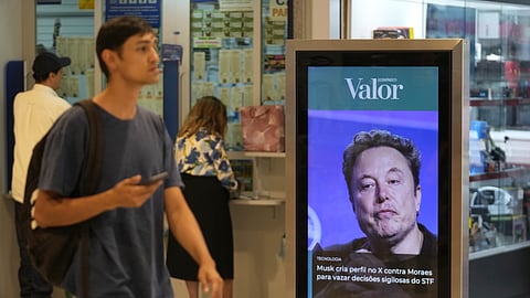 An ad by Valor media shows a photo of Elon Musk at a shopping center in Brasilia, Brazil, Monday, Sept. 2, 2024. The sign reads in Portuguese: "Musk creates profile on X against Moraes to leak confidential decisions of the Supreme Court," referring to Supreme Court Justice Alexandre de Moraes who ordered the platform blocked for having failed to name a local legal representative as required by law.
