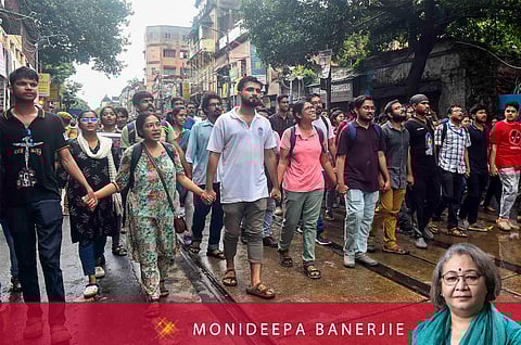 People take part in a protest march over the alleged sexual assault and murder of a trainee doctor, in Kolkata, Sunday, Sept. 8, 2024.