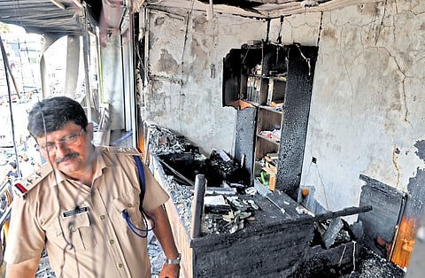 Charred remains of the insurance company office at Pappanamcode in Thiruvananthapuram where the fire broke out on Tuesday