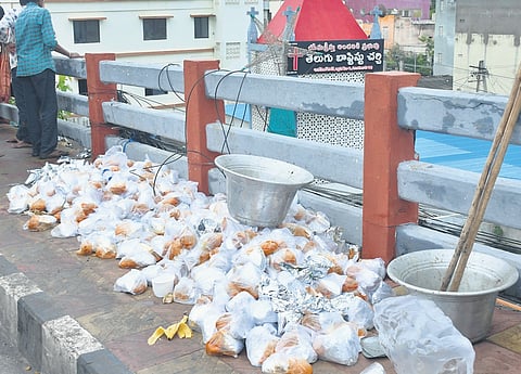 The dumped food packets on the Singh Nagar flyover in Vijayawada 