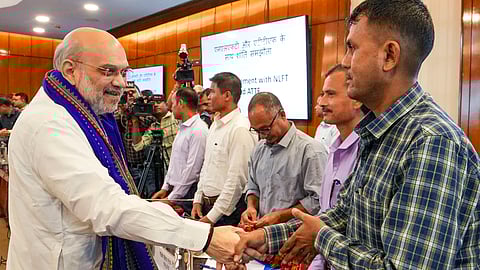 Union Home Minister Amit Shah with others during the signing of peace agreement between central and Tripura governments and two insurgent groups NLFT and ATTF (Photo | PTI)
