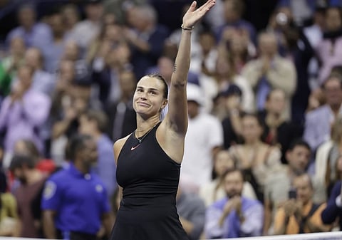 Aryna Sabalenka of Belarus waves after defeating Zheng Qinwen of China during the quarterfinals of the US Open tennis championship in New York.