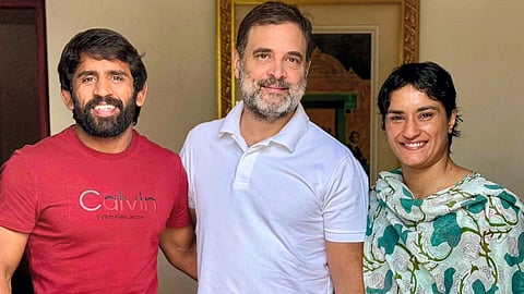 Leader of the Opposition Rahul Gandhi with wrestlers Vinesh Phogat and Bajrang Punia in New Delhi.