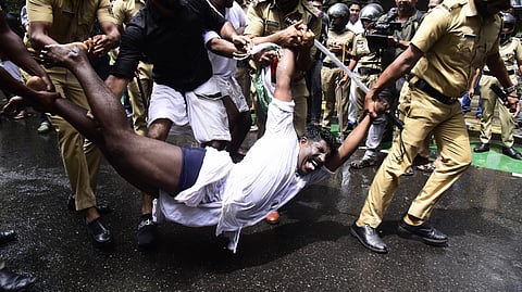 Police arrest and forcefully remove Youth Congress workers taking out a protest march to the city police commissioner’s office  in Kochi on Wednesday against the state government for allegedly shielding criminals in uniform.