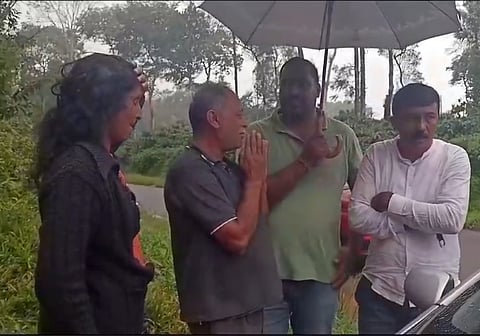 The couple (extreme left) confronted by GP members. 