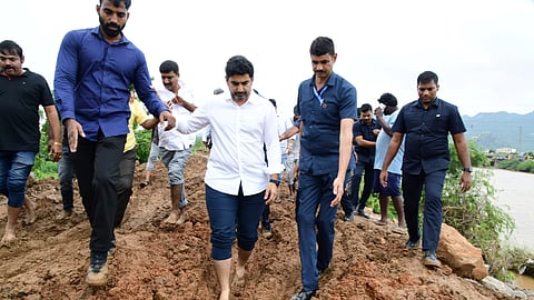 Minister for IT Nara Lokesh inspects the breach area on Wednesday. 